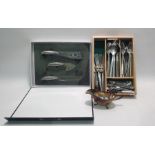 Assortment of stainless steel cutlery and a luxury cheese board and knife set