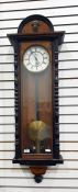 Tall Vienna regulator wall clock in polished mahogany case, the movement is single weight with large