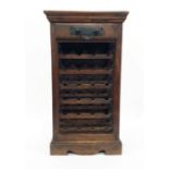 20th century wine rack in Eastern hardwood with single drawer above wine racks, plinth base, 54cm