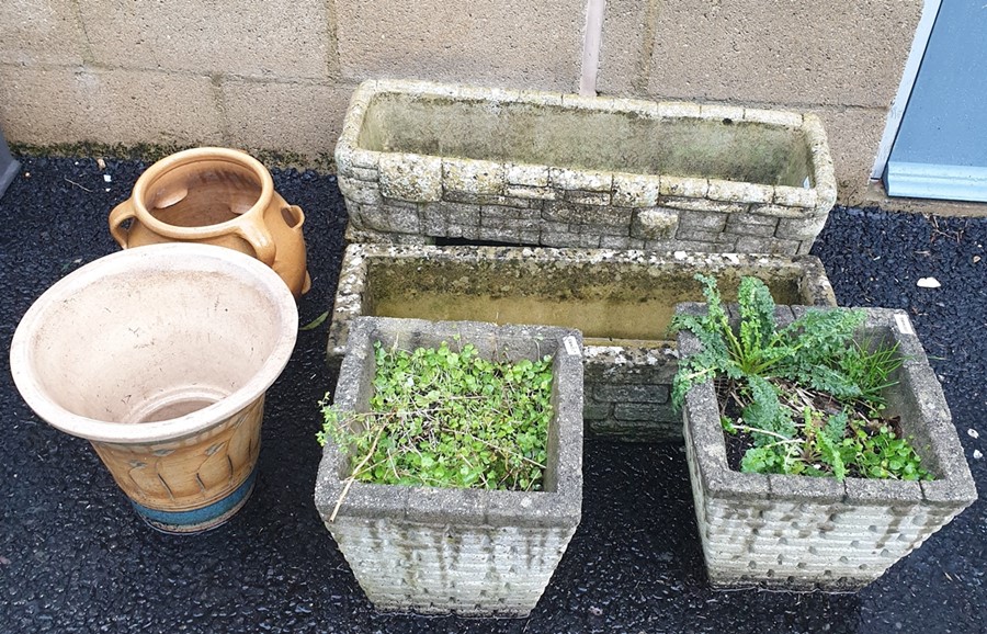 Two rectangular moulded concrete planters in the form of drystone walls, two tapered square