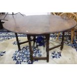 20th century oak oval gateleg dining table on turned and block supports, stretchered base