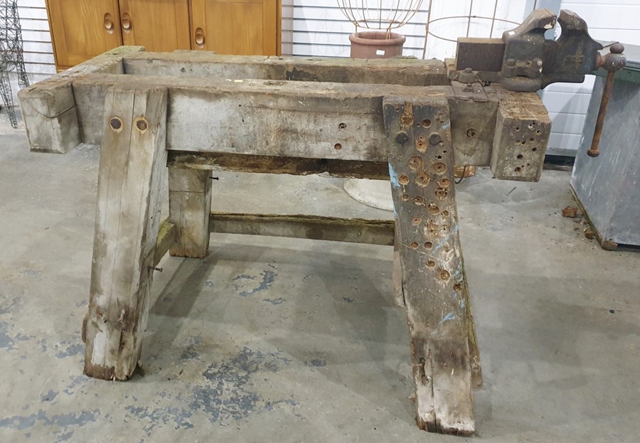 Substantial wooden workbench with attached engineer's vice, 110cm x 50cm