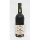 Bottle of Taylors 1975 vintage port, label complete as is the wax capsule