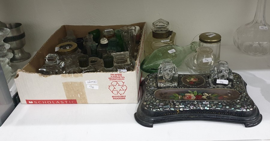 Collection of glass and metal-mounted inkwells, various medical bottles, an eye bath, a measuring