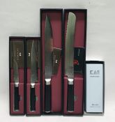 Four boxed Japanese Shun kitchen knives and a whetstone