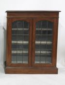 20th century oak cabinet, the rectangular top with moulded edge, above two leaded glazed doors