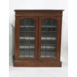 20th century oak cabinet, the rectangular top with moulded edge, above two leaded glazed doors