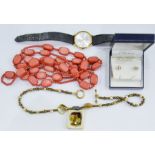 TIN of assorted costume jewellery to include necklaces, wristwatch, etc