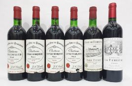 Six assorted bottles from the Bordeaux region including four bottles of Chateau Lestage-Darquier