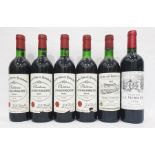 Six assorted bottles from the Bordeaux region including four bottles of Chateau Lestage-Darquier