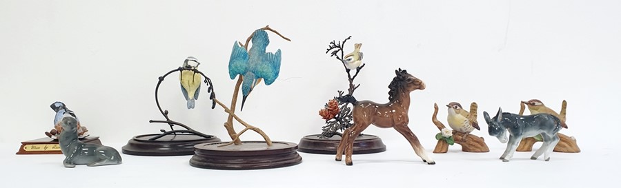 Beswick model of a foal together with a continental German pottery model donkey, a German pottery