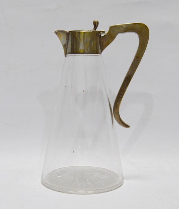 Edwardian silver-mounted glass claret jug, conical with star-cut base and having silver mount with