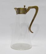 Edwardian silver-mounted glass claret jug, conical with star-cut base and having silver mount with