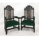 Pair of Victorian oak armchairs in the Gothic-taste, the top rail with green mask, backsplat