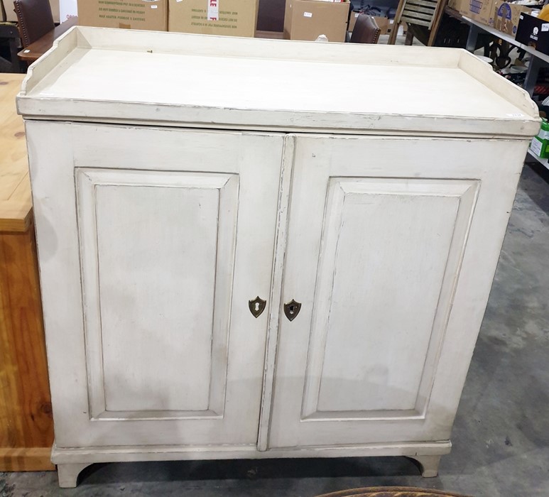 Cream painted 19th century cupboard, the rectangular top three-quarter galleried above two