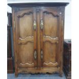 French armoire with two doors enclosing hanging space, brass escutcheons and hinges