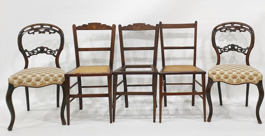 Pair of Victorian mahogany salon chairs with serpentine fronts, cabriole supports and three