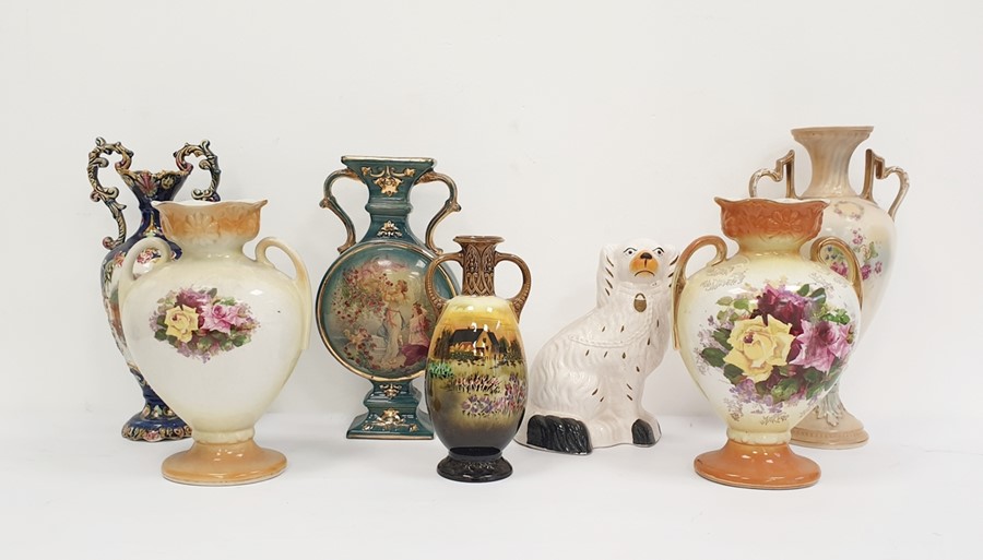 19th century Staffordshire pottery spaniel, together with a pair of Continental pottery two