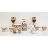 19th century continental porcelain part teaset with white ground decorated with gilt scrolls,