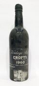 Bottle of Crofts 1960 vintage port, label is complete and wax capsule intact but damaged showing the