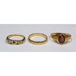 9 ct gold wedding band, 18 ct dress ring and a gold coloured ring