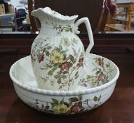 Victorian pottery toilet ewer and basin, spirally ribbed and flowering dog-rose spray decorated