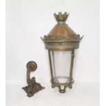 Copper, brass and glass lantern, the top castellated above a copper dome, cylindrical glass shade