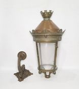 Copper, brass and glass lantern, the top castellated above a copper dome, cylindrical glass shade