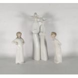 20th century Lladro porcelain figure group of two nuns and a pair of Lladro figurines of boy and