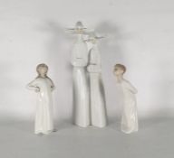 20th century Lladro porcelain figure group of two nuns and a pair of Lladro figurines of boy and