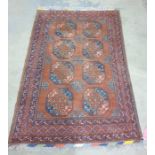 Caucasian-style rug with brown border and two rows of four elephant foot guls surrounded by three