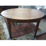 Circular farmhouse-style plank top table raised upon four tapering supports, diameter 135cm approx