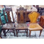 Pair of 18th century-style oak chairs with vase-shaped back splats, wooden seat and turned block