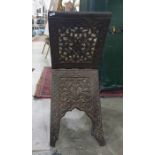 Eastern style folding magazine rack with carved and pierced decoration