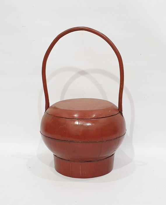 Red lacquer oriental treen rice basket with loop handleCondition Reportoverall condition without