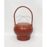 Red lacquer oriental treen rice basket with loop handleCondition Reportoverall condition without