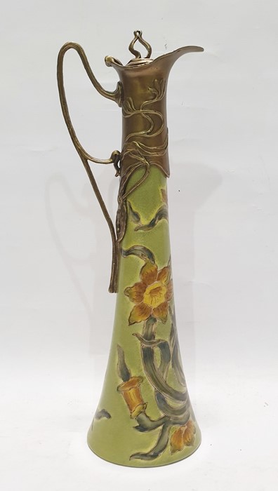 Art Nouveau style ceramic and gilt metal-mounted claret jug, the tall flared body decorated with