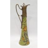 Art Nouveau style ceramic and gilt metal-mounted claret jug, the tall flared body decorated with