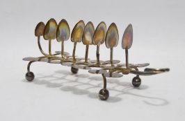 Early Victorian silver toast rack, seven-division, in the form of lilypad leaves and raised on