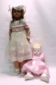 Large composition doll with sleeping blue grey eyes, open mouth, blonde wig with ringlets, moulded