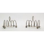 Pair of George V silver four section toast racks, raised on ball feet (S W Smith and Co, Birmingham,