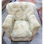 Armchair in green loose covers