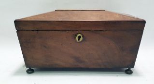 Mahogany sarcophagus-shaped tea caddy with brass escutcheon and brass bun feet and a brass-bodied