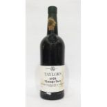 Bottle of Taylors 1975 vintage port, label complete and wax capsule top is present