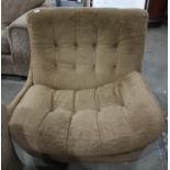 Mid twentieth century Englander designer swivel chair, upholstered in brown with buttonbackCondition