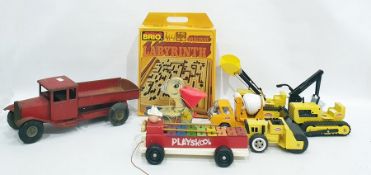 Assortment of toys to include Brio Labyrinth, Tonka toys, xylophone, pull along duck, tip up truck