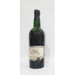 One bottle of Warre's port 1963 vintage port. Label is complete but damaged, wax capsule is