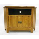 20th century oak television stand with open recess above two cupboard doors