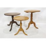 Three circular occasional centre tables including elm-topped table on turned supports and cabriole