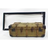 Vintage trunk, canvas and banded with wood, luggage labels , name printed on top with a large carved